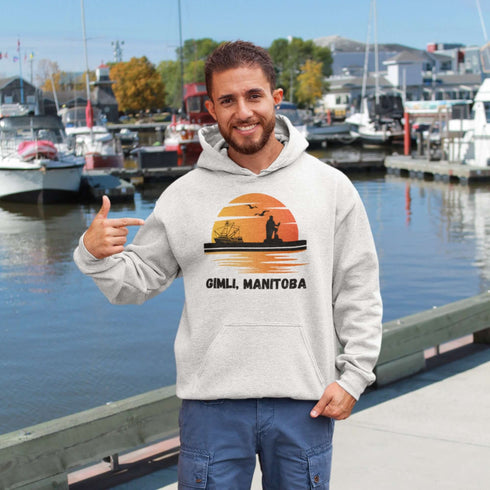 Featuring a sunset backdrop over the charming town of Gimli, Manitoba, with the iconic Viking statue front and center, this hoodie is your stylish ticket to Viking vibes without having to set sail.