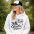 Woman wearing hoodie with goalie mom text and diving goalkeeper graphic