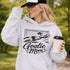 Woman wearing hoodie with goalie mom text and diving goalkeeper graphic