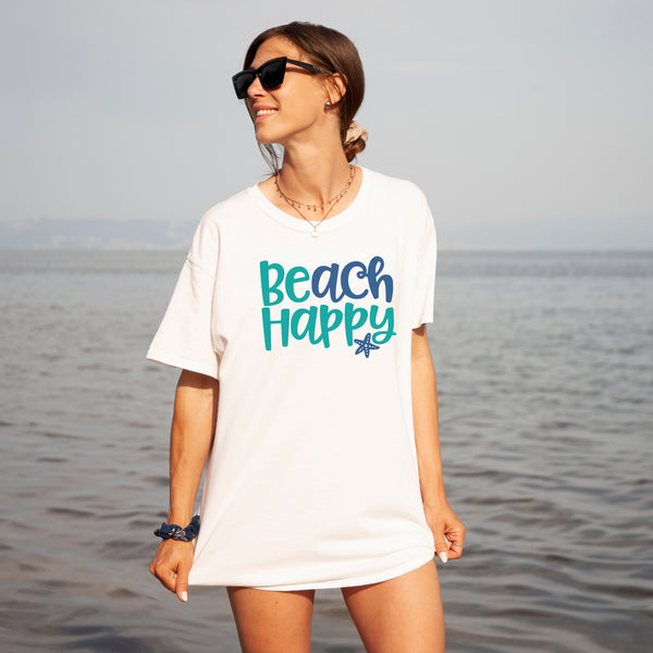 Introducing our "Beach Happy" t-shirt, the perfect garment to capture the essence of sunshine, sand, and beach! Crafted with comfort and style in mind, this soft and breathable tee is ideal for lazy days by the shore or casual strolls along the boardwalk.