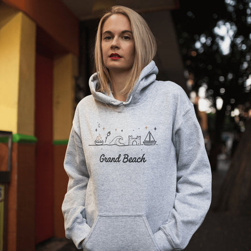 Bring the fun of summer days and campfire nights to your wardrobe with our Grand Beach Doodle hoodie!