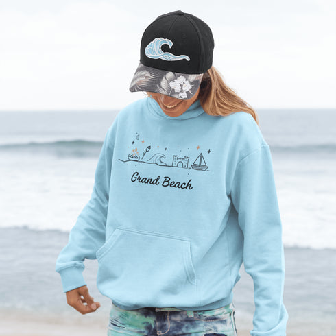 Bring the fun of summer days and campfire nights to your wardrobe with our Grand Beach Doodle hoodie!