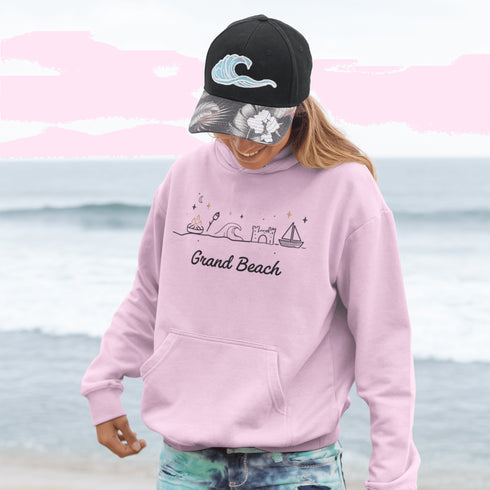 Bring the fun of summer days and campfire nights to your wardrobe with our Grand Beach Doodle hoodie!