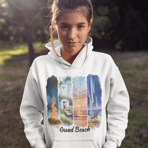 Celebrate the natural beauty and charm of Grand Beach with this cozy and stylish hoodie, featuring a soft watercolor collage of iconic local scenes.