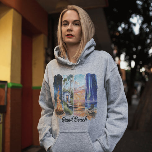 Celebrate the natural beauty and charm of Grand Beach with this cozy and stylish hoodie, featuring a soft watercolor collage of iconic local scenes.