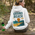 Bring the beach vibes wherever you go with our Grand Beach Retro Scene hoodie — a cozy nod to one of Manitoba’s most iconic summer destinations.