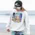 Celebrate the natural beauty and charm of Grand Beach with this cozy and stylish hoodie, featuring a soft watercolor collage of iconic local scenes.