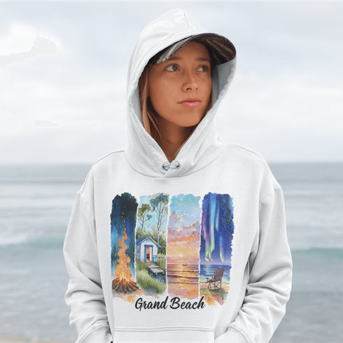 Celebrate the natural beauty and charm of Grand Beach with this cozy and stylish hoodie, featuring a soft watercolor collage of iconic local scenes.