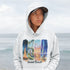 Celebrate the natural beauty and charm of Grand Beach with this cozy and stylish hoodie, featuring a soft watercolor collage of iconic local scenes.