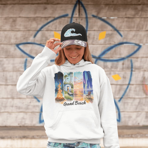 Celebrate the natural beauty and charm of Grand Beach with this cozy and stylish hoodie, featuring a soft watercolor collage of iconic local scenes.