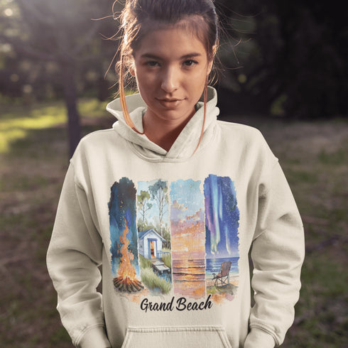 Celebrate the natural beauty and charm of Grand Beach with this cozy and stylish hoodie, featuring a soft watercolor collage of iconic local scenes.