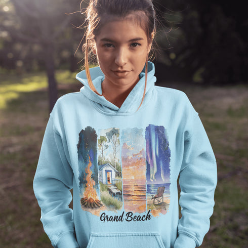 Celebrate the natural beauty and charm of Grand Beach with this cozy and stylish hoodie, featuring a soft watercolor collage of iconic local scenes.