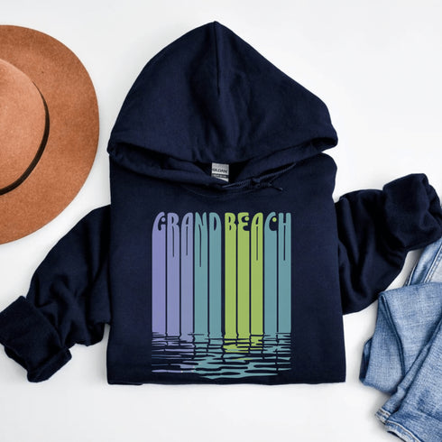 Bring the beach vibes wherever you go with our Grand Beach retro hoodie — a bold and colorful tribute to one of Manitoba’s most loved summer destinations.