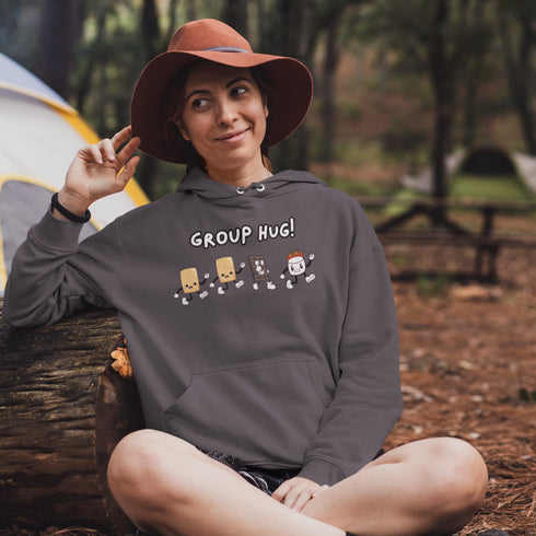 Introducing the ultimate camping companion - the Group Hug Camping Hoodie! Picture this: adorable cartoon s'mores characters chasing a rogue burning marshmallow across your chest, all while proclaiming "Group Hug!" Because who wouldn't want a cuddly trio of snacks on their apparel?