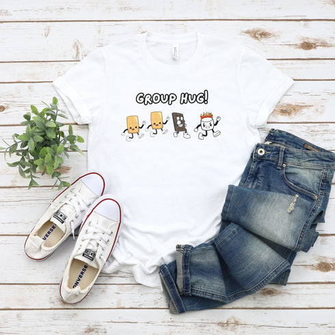 Introducing the ultimate camping fashion statement - our hilarious Group Hug T-shirt! Picture this: adorable cartoon s'mores characters sprinting after a rogue, blazing marshmallow like it's the last one on Earth. It's a scene straight out of a comedy sketch!
