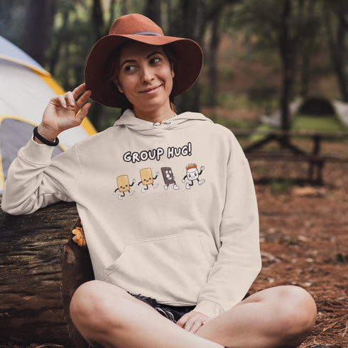 Introducing the ultimate camping companion - the Group Hug Camping Hoodie! Picture this: adorable cartoon s'mores characters chasing a rogue burning marshmallow across your chest, all while proclaiming "Group Hug!" Because who wouldn't want a cuddly trio of snacks on their apparel?