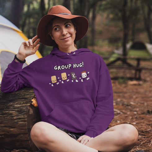 Introducing the ultimate camping companion - the Group Hug Camping Hoodie! Picture this: adorable cartoon s'mores characters chasing a rogue burning marshmallow across your chest, all while proclaiming "Group Hug!" Because who wouldn't want a cuddly trio of snacks on their apparel?
