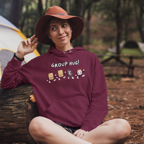 Introducing the ultimate camping companion - the Group Hug Camping Hoodie! Picture this: adorable cartoon s'mores characters chasing a rogue burning marshmallow across your chest, all while proclaiming "Group Hug!" Because who wouldn't want a cuddly trio of snacks on their apparel?