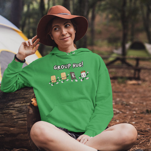 Introducing the ultimate camping companion - the Group Hug Camping Hoodie! Picture this: adorable cartoon s'mores characters chasing a rogue burning marshmallow across your chest, all while proclaiming "Group Hug!" Because who wouldn't want a cuddly trio of snacks on their apparel?