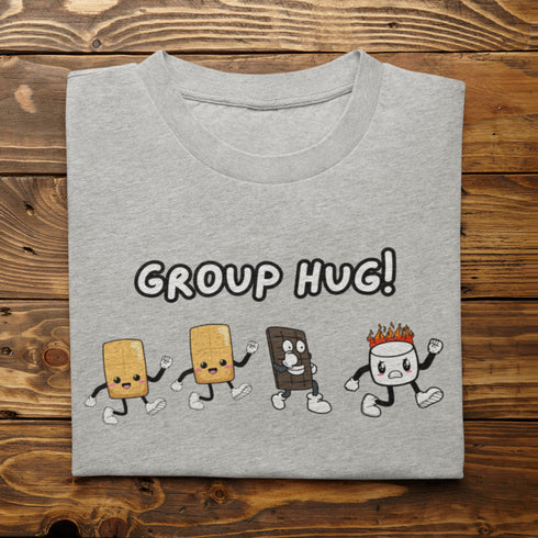 Introducing the ultimate camping fashion statement - our hilarious Group Hug T-shirt! Picture this: adorable cartoon s'mores characters sprinting after a rogue, blazing marshmallow like it's the last one on Earth. It's a scene straight out of a comedy sketch!