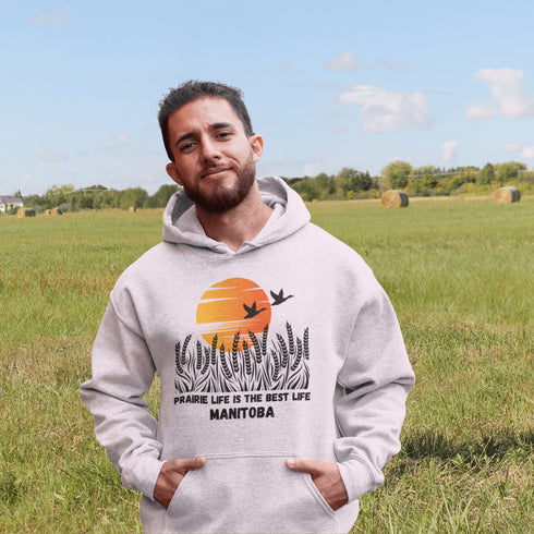 Featuring a stunning design of golden wheat fields stretching across the horizon under a vibrant Canadian sunset, this hoodie captures the peaceful simplicity of prairie life
