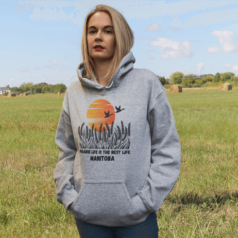 Featuring a stunning design of golden wheat fields stretching across the horizon under a vibrant Canadian sunset, this hoodie captures the peaceful simplicity of prairie life