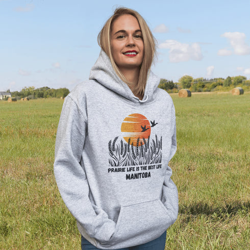 Featuring a stunning design of golden wheat fields stretching across the horizon under a vibrant Canadian sunset, this hoodie captures the peaceful simplicity of prairie life