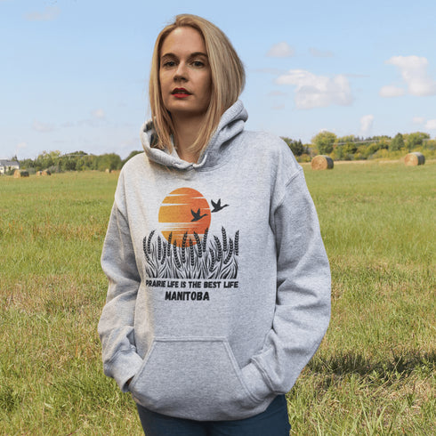 Featuring a stunning design of golden wheat fields stretching across the horizon under a vibrant Canadian sunset, this hoodie captures the peaceful simplicity of prairie life