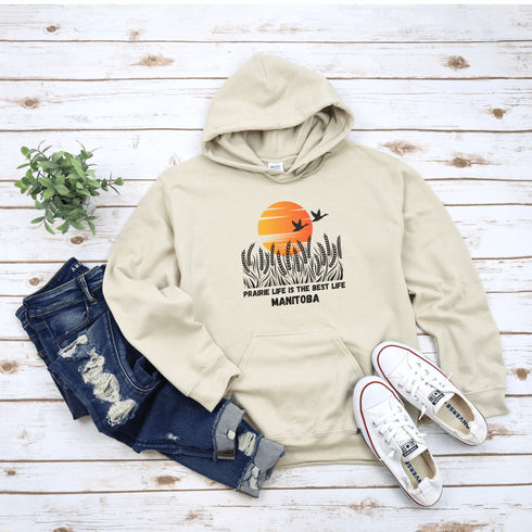Featuring a stunning design of golden wheat fields stretching across the horizon under a vibrant Canadian sunset, this hoodie captures the peaceful simplicity of prairie life