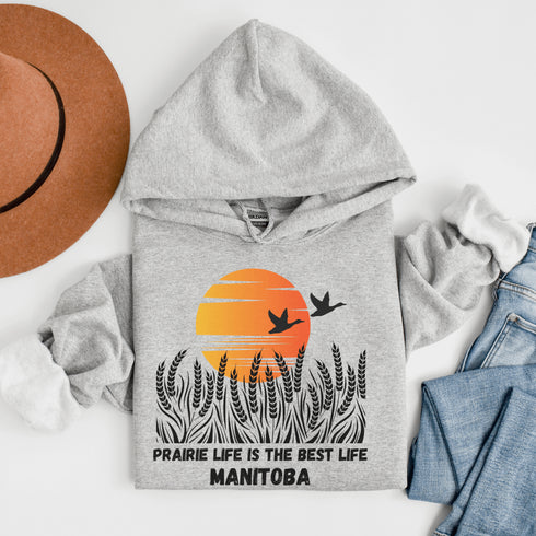 Featuring a stunning design of golden wheat fields stretching across the horizon under a vibrant Canadian sunset, this hoodie captures the peaceful simplicity of prairie life