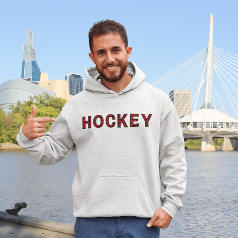 Introducing the Canada Hockey Hoodie, featuring "Hockey" in bold red and black Canadian plaid lettering—because nothing says “I’m Canadian” like plaid and hockey pride.