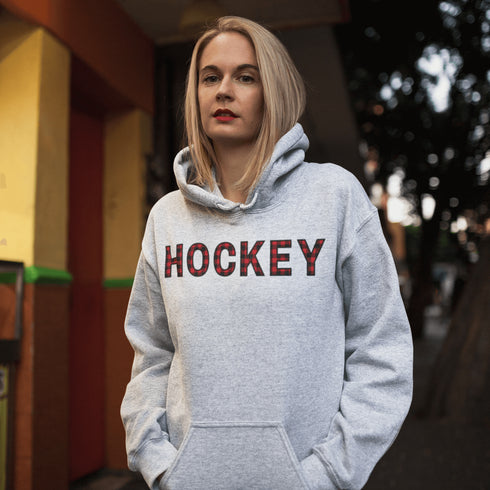 Introducing the Canada Hockey Hoodie, featuring "Hockey" in bold red and black Canadian plaid lettering—because nothing says “I’m Canadian” like plaid and hockey pride.