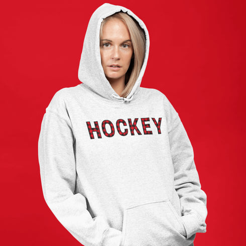 Introducing the Canada Hockey Hoodie, featuring "Hockey" in bold red and black Canadian plaid lettering—because nothing says “I’m Canadian” like plaid and hockey pride.