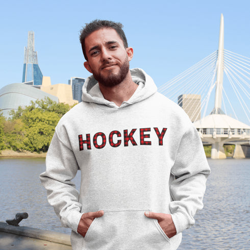 Introducing the Canada Hockey Hoodie, featuring "Hockey" in bold red and black Canadian plaid lettering—because nothing says “I’m Canadian” like plaid and hockey pride.