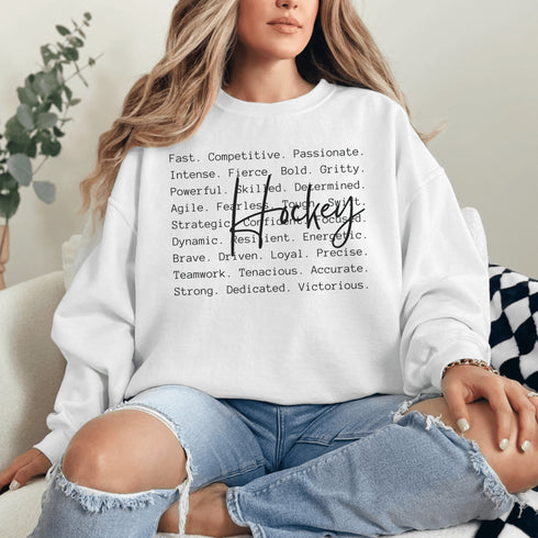 Hockey sweatshirt with bold script lettering and descriptive words design on a cozy crewneck, perfect for hockey players and fans