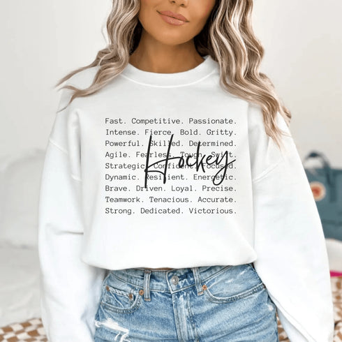 Hockey sweatshirt with bold script lettering and descriptive words design on a cozy crewneck, perfect for hockey players and fans