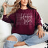Hockey Mom sweatshirt with handwritten script typography and descriptive text design on a cozy crewneck, perfect for rink moms and hockey season