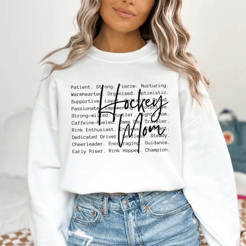 Hockey Mom sweatshirt with handwritten script typography and descriptive text design on a cozy crewneck, perfect for rink moms and hockey season