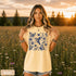 Vintage-inspired hummingbird and butterfly wildflower graphic printed on a Butter colored Comfort Colors t-shirt.