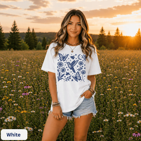 Vintage-inspired hummingbird and butterfly wildflower graphic printed on a white Comfort Colors t-shirt.