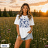Vintage-inspired hummingbird and butterfly wildflower graphic printed on a white Comfort Colors t-shirt.