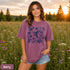 Vintage-inspired hummingbird and butterfly wildflower graphic printed on a Berry colored Comfort Colors t-shirt.