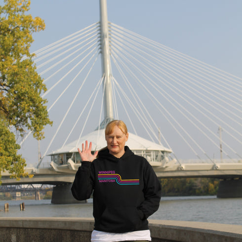 This gender neutral hoodie features a colorful line graphic that pays homage to the vibrant city of Winnipeg, Manitoba.