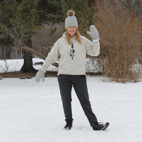 This hoodie features an eye-catching graphic that includes a Polar bear, a Wolf howling at the moon, and a tree with a sun.