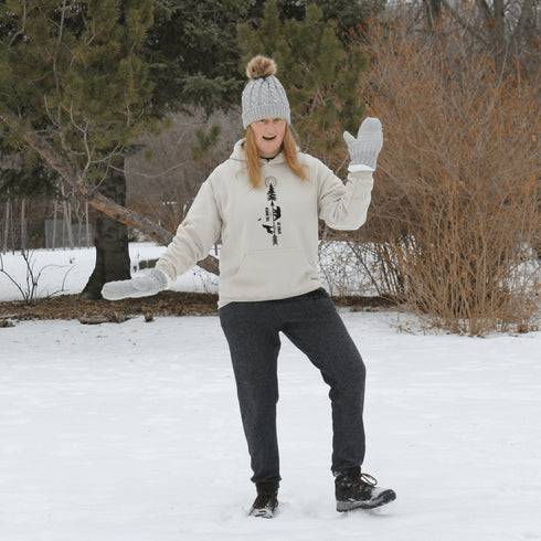 This hoodie features an eye-catching graphic that includes a Polar bear, a Wolf howling at the moon, and a tree with a sun.