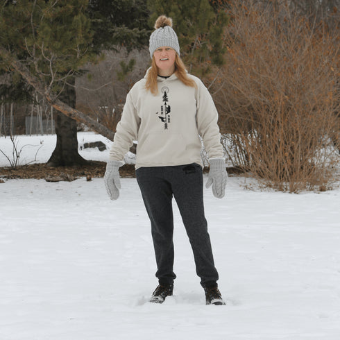 This hoodie features an eye-catching graphic that includes a Polar bear, a Wolf howling at the moon, and a tree with a sun.
