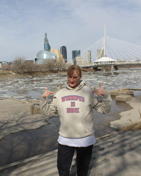 Introducing the ultimate statement of pride and comfort: the "Winnipeg Is Home" Hoodie. Designed for those who hold Winnipeg close to their heart, this hoodie is more than just a piece of clothing—it's a declaration of love for the heart of the prairies.