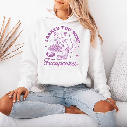 Featuring a sarcastic-looking cat holding a tray of cupcakes, this design pairs sugary sweetness with a healthy dose of sass.