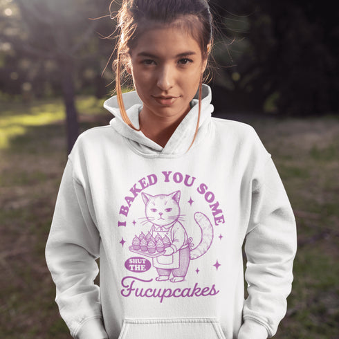 Featuring a sarcastic-looking cat holding a tray of cupcakes, this design pairs sugary sweetness with a healthy dose of sass.