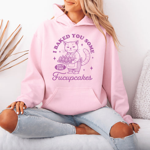 Featuring a sarcastic-looking cat holding a tray of cupcakes, this design pairs sugary sweetness with a healthy dose of sass.